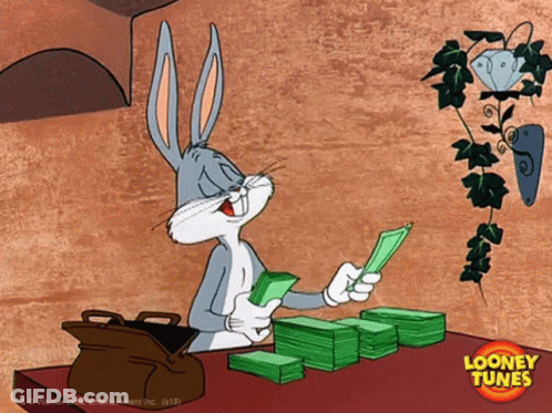 A Cartoon Of Bugs Bunny Sitting At A Table With A Stack Of Money GIF