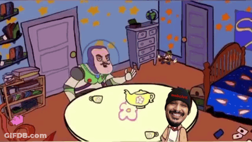 A Cartoon Of Buzz Lightyear Sitting At A Table Next To A Man Wearing A Black Beanie GIF