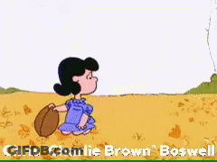 A Cartoon Of Charlie Brown And Lucy Brown Playing With A Ball GIF