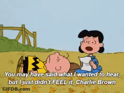 A Cartoon Of Charlie Brown And Lucy Brown Reading A Letter GIF