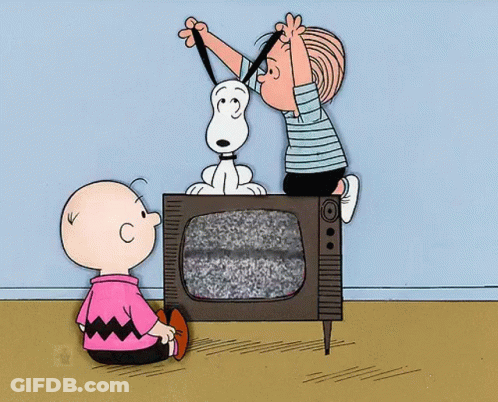 A Cartoon Of Charlie Brown And Snoopy Looking At A Television GIF