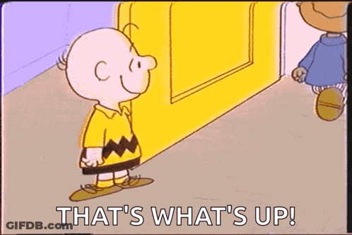 A Cartoon Of Charlie Brown Kissing Another Cartoon Character With The Words That 'S What 'S Up ! GIF