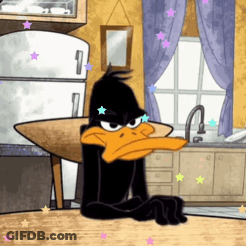 A Cartoon Of Daffy Duck Sitting At A Table GIF