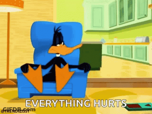 A Cartoon Of Daffy Duck Sitting In A Chair With The Words Everything Hurts Written Below Him . GIF