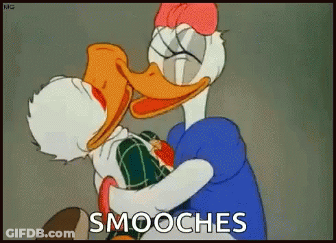 A Cartoon Of Donald Duck And Daisy Duck Hugging Each Other With The Words Smooches Above Them GIF