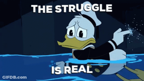 A Cartoon Of Donald Duck In The Water With The Words " The Struggle Is Real " Above Him GIF