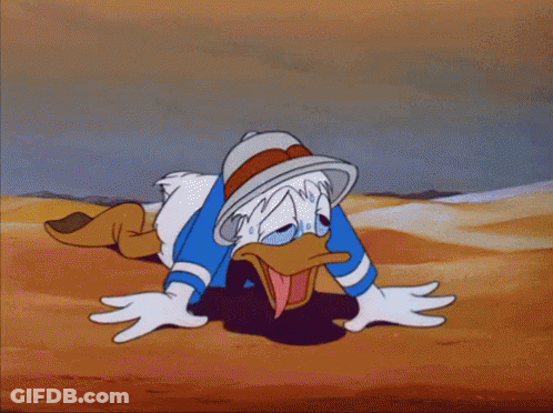 A Cartoon Of Donald Duck Laying In The Sand GIF