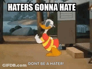 A Cartoon Of Donald Duck Standing In Front Of A Trailer With The Words `` Haters Gonna Hate Dont Be A Hater '' GIF
