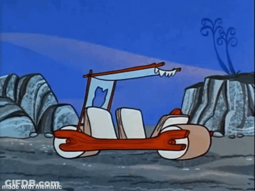 A Cartoon Of Flintstone Driving A Car With The Caption Made With Mematic GIF