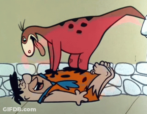 A Cartoon Of Flintstone Laying On The Ground With A Dinosaur On His Back GIF