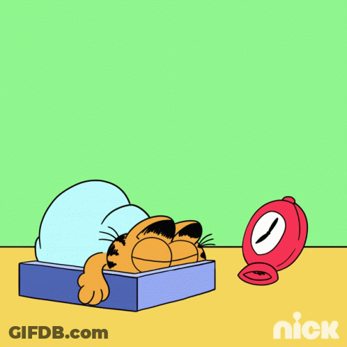 A Cartoon Of Garfield Laying In Bed With The Words I Hate Mondays GIF