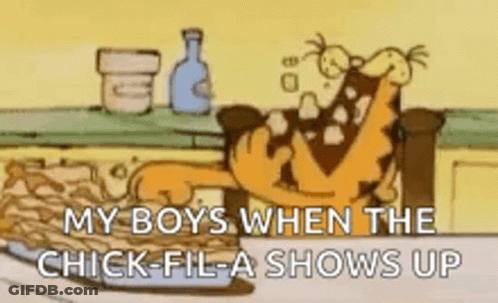 A Cartoon Of Garfield Sitting On A Couch Eating Chicken Nuggets . GIF