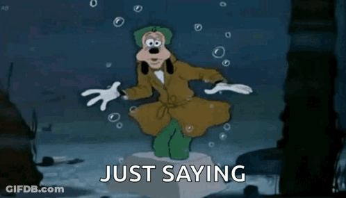 A Cartoon Of Goofy Is Standing On A Pedestal With The Words Just Saying Behind Him . GIF