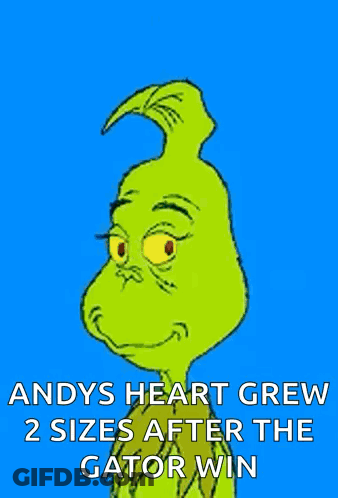 A Cartoon Of Grinch With The Caption Andy 'S Heart Grew 2 Sizes After The Gator Win . GIF