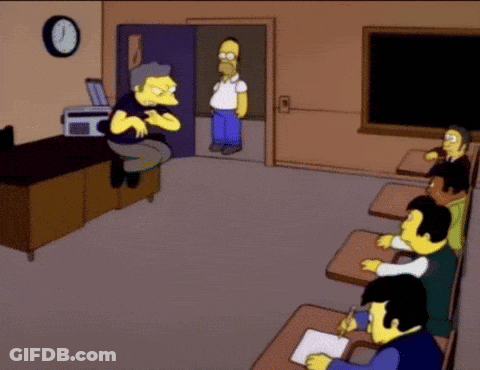 A Cartoon Of Homer Simpson In A Classroom GIF
