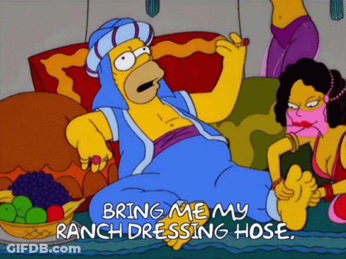 A Cartoon Of Homer Simpson Laying On A Couch With The Words Bring Me My Ranch Dressing Hose On The Bottom GIF
