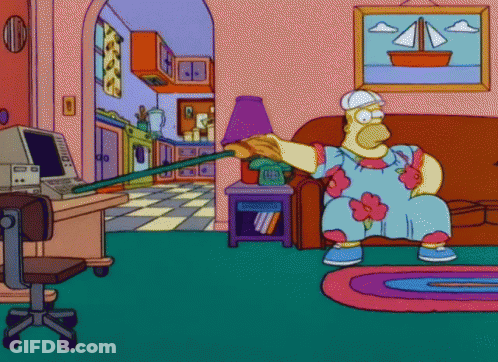 A Cartoon Of Homer Simpson Sitting On A Couch Holding A Stick GIF