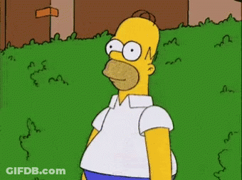 A Cartoon Of Homer Simpson Standing In A Grassy Area GIF