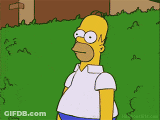 A Cartoon Of Homer Simpson Standing In A Grassy Yard GIF