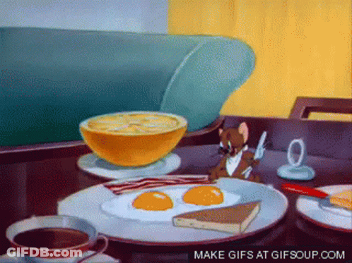 A Cartoon Of Jerry Eating Breakfast With Eggs Bacon And Coffee GIF