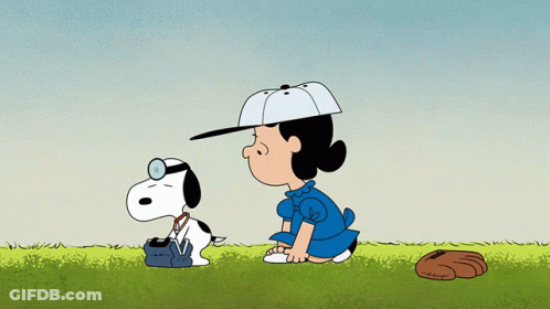 A Cartoon Of Lucy And Snoopy With A Baseball Glove On The Ground GIF