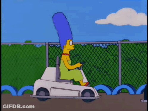 A Cartoon Of Marge Simpson Driving A Small White Car GIF