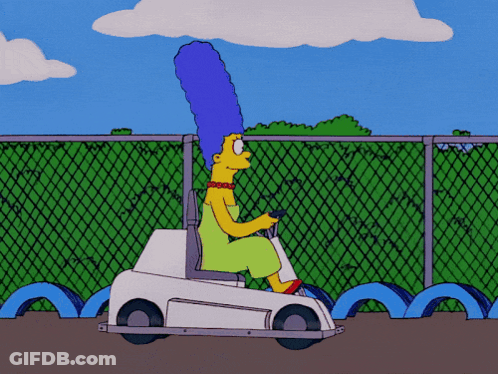 A Cartoon Of Marge Simpson Driving A Small White Car GIF