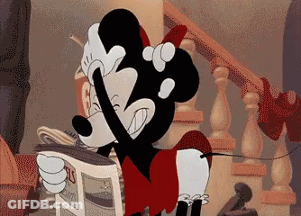 A Cartoon Of Mickey Mouse Holding A Newspaper That Says ' Straits ' On It GIF