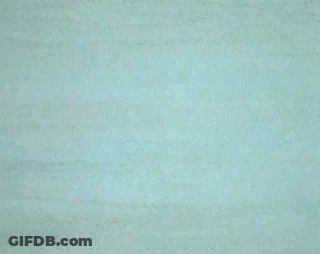 A Cartoon Of Mickey Mouse In A Wet Suit Flexing His Muscles In The Water GIF