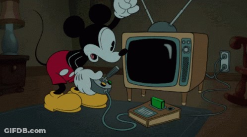 A Cartoon Of Mickey Mouse Is Playing A Video Game GIF