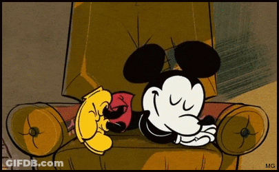 A Cartoon Of Mickey Mouse Sleeping In A Chair With Mg Written On The Bottom GIF