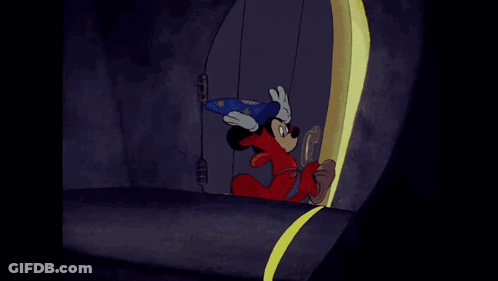 A Cartoon Of Mickey Mouse Wearing A Wizard Costume GIF