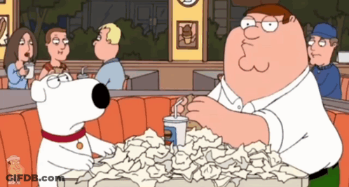 Peter Griffin Sitting At Table With Papers GIF