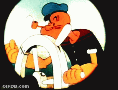 A Cartoon Of Popeye Holding A Steering Wheel GIF