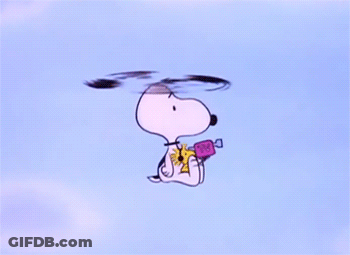 A Cartoon Of Snoopy Flying Through The Air GIF