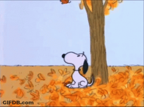 A Cartoon Of Snoopy Hanging From A Tree With A Balloon In His Mouth . GIF