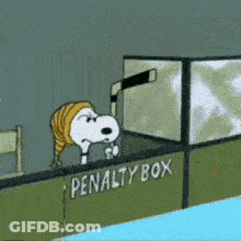 A Cartoon Of Snoopy Holding A Hockey Stick In Front Of The Penalty Box GIF