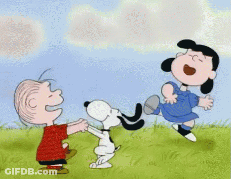 A Cartoon Of Snoopy , Lucy And Linus Playing With A Dog GIF
