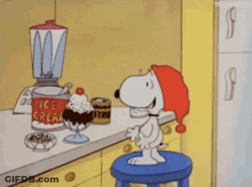 A Cartoon Of Snoopy Sitting On A Blue Stool Eating Ice Cream GIF