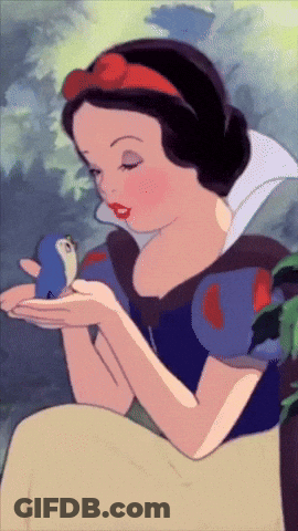 A Cartoon Of Snow White Holding A Small Bird In Her Hands GIF