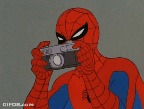 A Cartoon Of Spider-Man Taking A Picture With His Camera GIF
