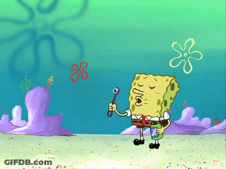 A Cartoon Of Spongebob Blowing Soap Bubbles In The Ocean GIF
