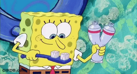 A Cartoon Of Spongebob Brushing His Teeth While Holding Two Tubes Of Toothpaste GIF