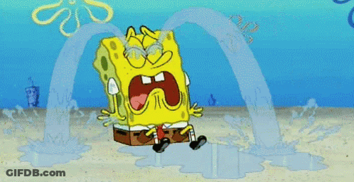 A Cartoon Of Spongebob Squarepants Crying In The Sand GIF