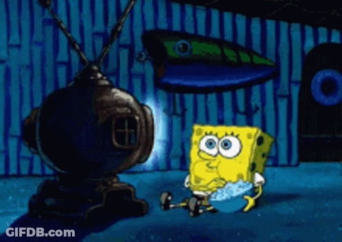 A Cartoon Of Spongebob Squarepants Sitting In Front Of A Tv GIF