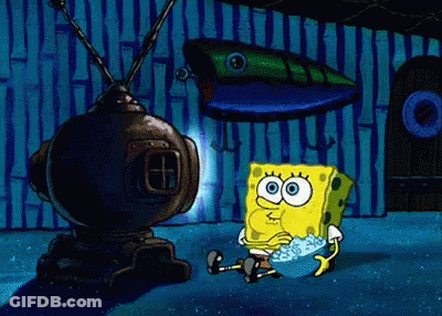 A Cartoon Of Spongebob Squarepants Sitting In Front Of A Tv GIF