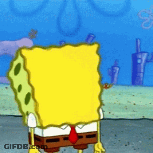 A Cartoon Of Spongebob Wearing A Suit And Tie Standing In The Sand . GIF