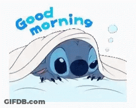 A Cartoon Of Stitch Peeking Out From Under A Blanket With The Words `` Good Morning '' . GIF