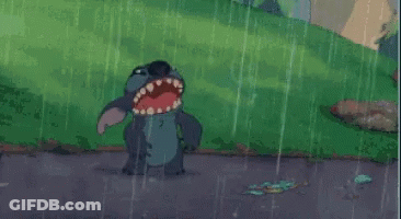 A Cartoon Of Stitch Standing In The Rain GIF
