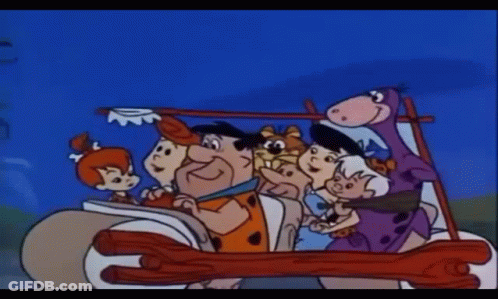 A Cartoon Of The Flintstones Driving A Car GIF